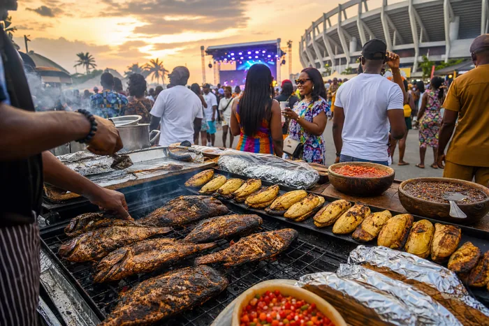 Vendors grilling roasted plantain and fish as festivalgoers gather around food stands in Port Harcourt.