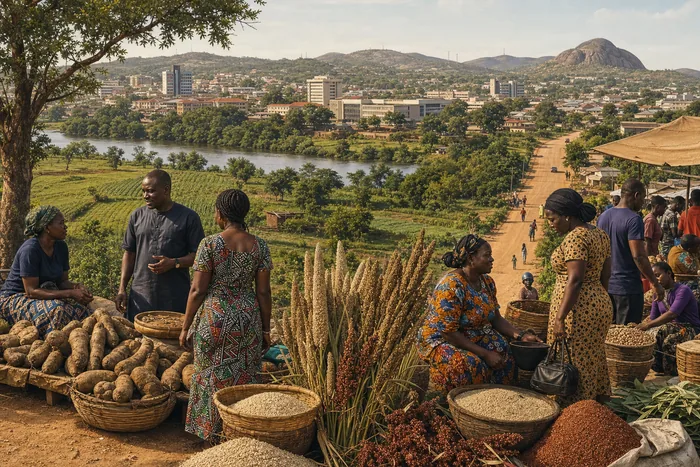 Tiv farmers with yams and grains in a Benue landscape, balanced with a town skyline in the background.